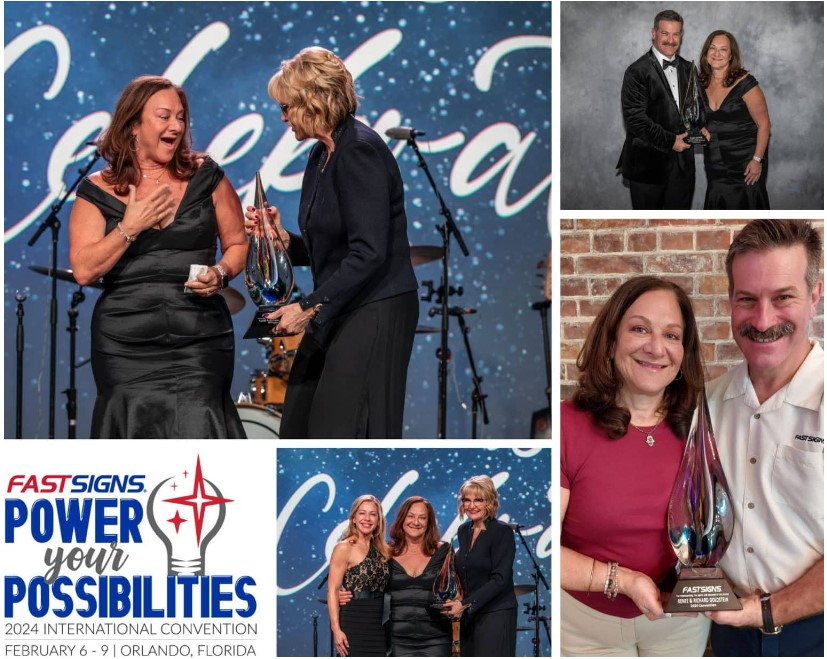 woman receiving a trophy on stage